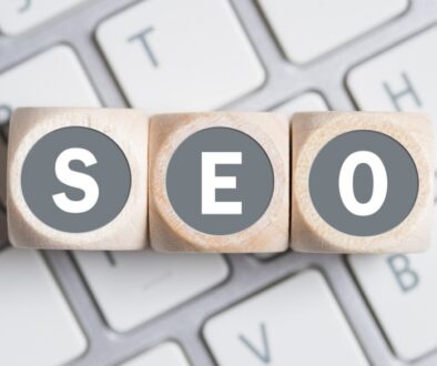 SEO wooden letter blocks on keyboard.