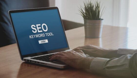 A person at their laptop with a SEO keyword search tool to help find SEO keywords.
