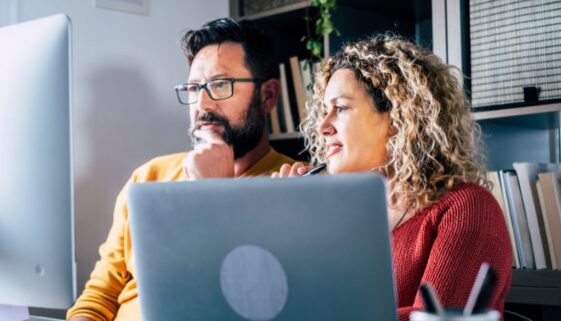 the-blu-group-advertising-&-marketing-refresh-your-website-for-the-new-year-2026-two-workers-looking-at-computer