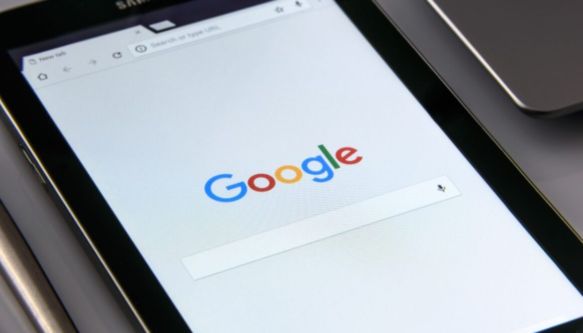 A tablet screen is open to the Google Search page.