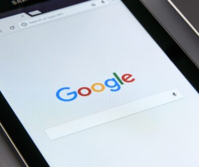 A tablet screen is open to the Google Search page.
