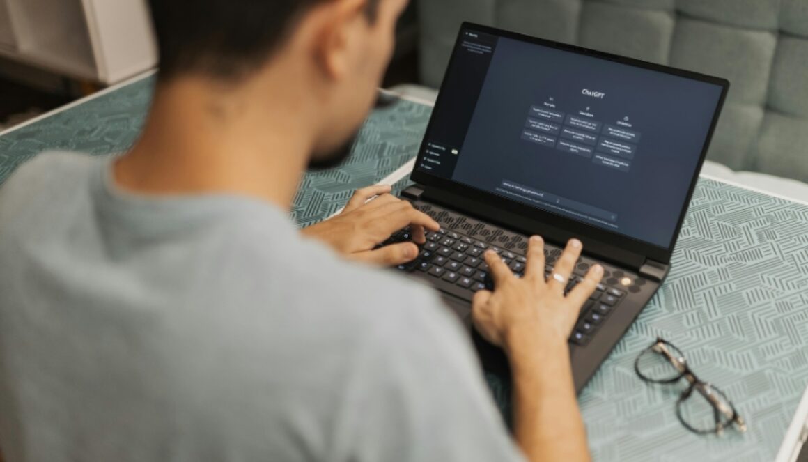 Person using ChatGPT on a laptop